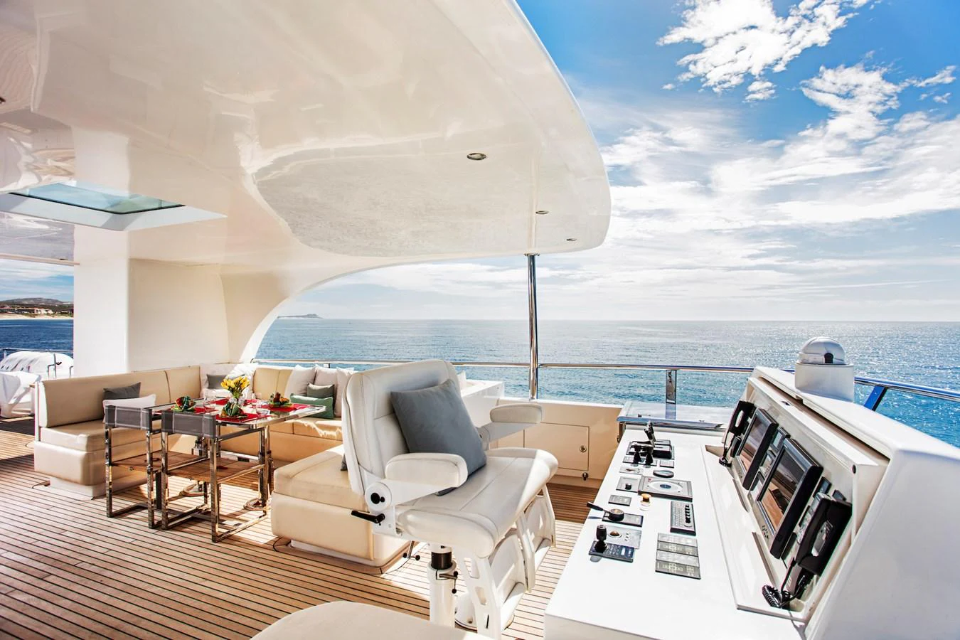 a room with a large window and a view of the ocean aboard KOMOKWA Yacht for Charter