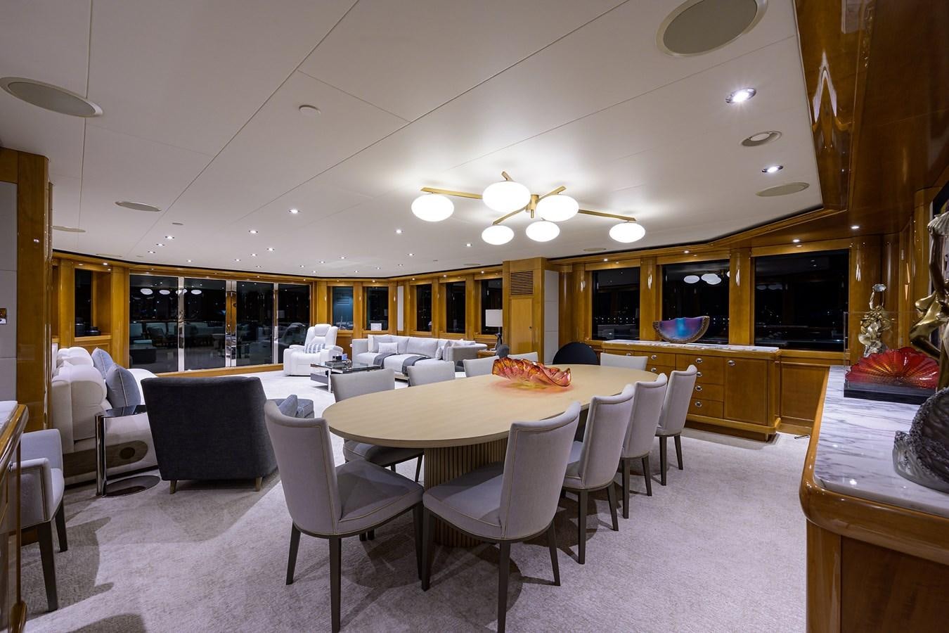 a large room with tables and chairs aboard SEANASH Yacht for Charter