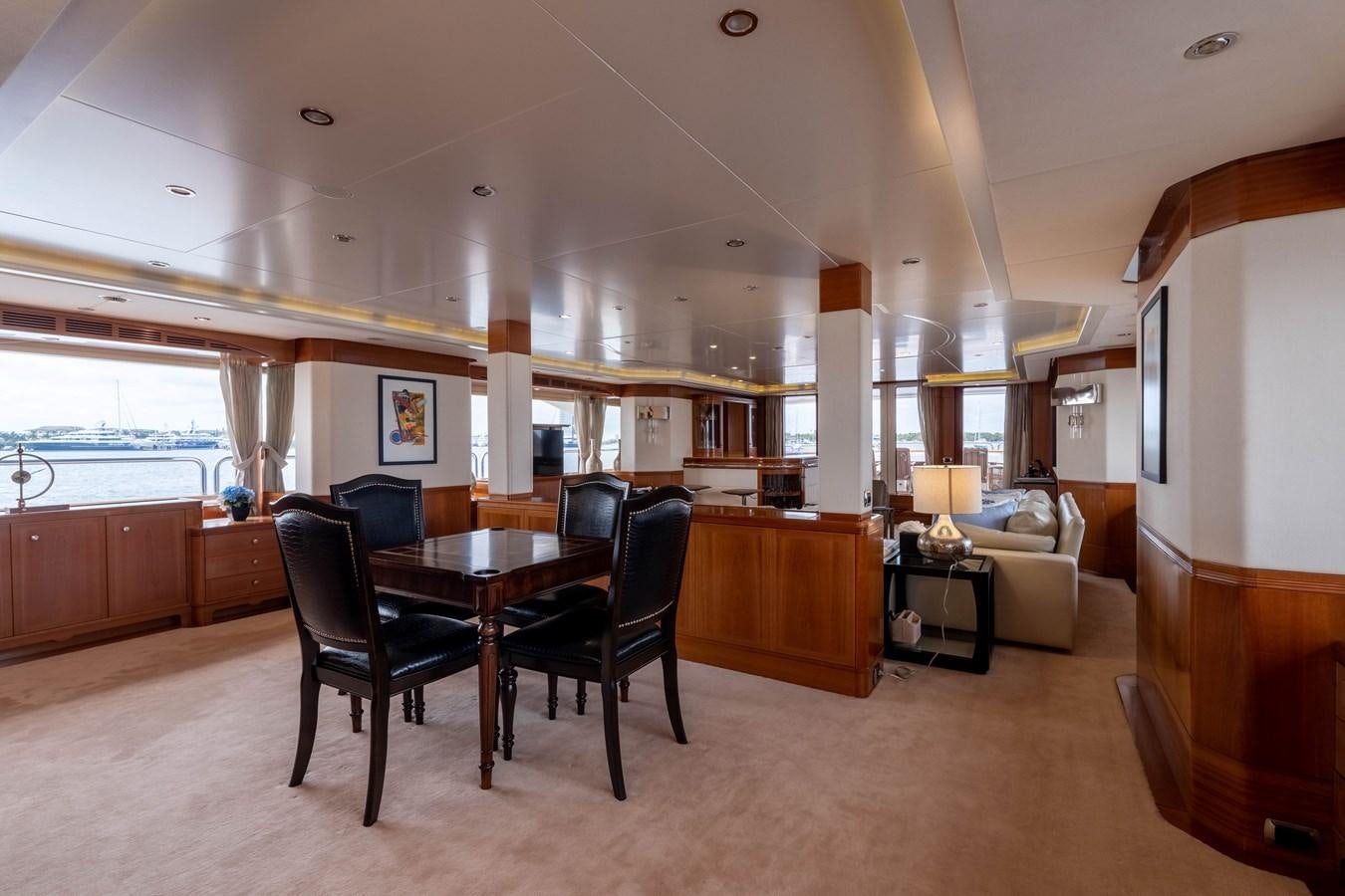 a large room with a table and chairs aboard ALEGRIA Yacht for Sale