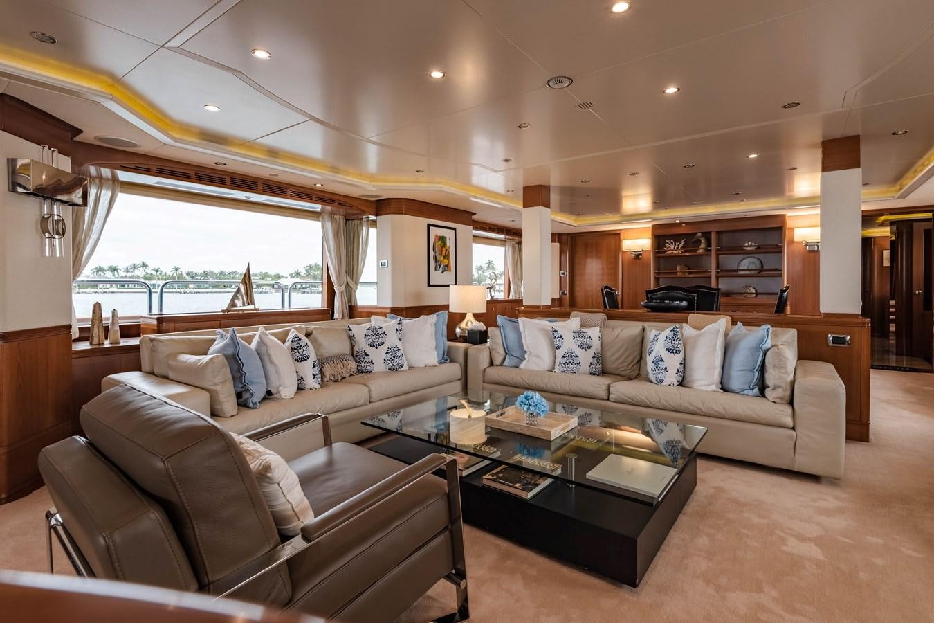 a living room with a couch and a coffee table aboard ALEGRIA Yacht for Sale
