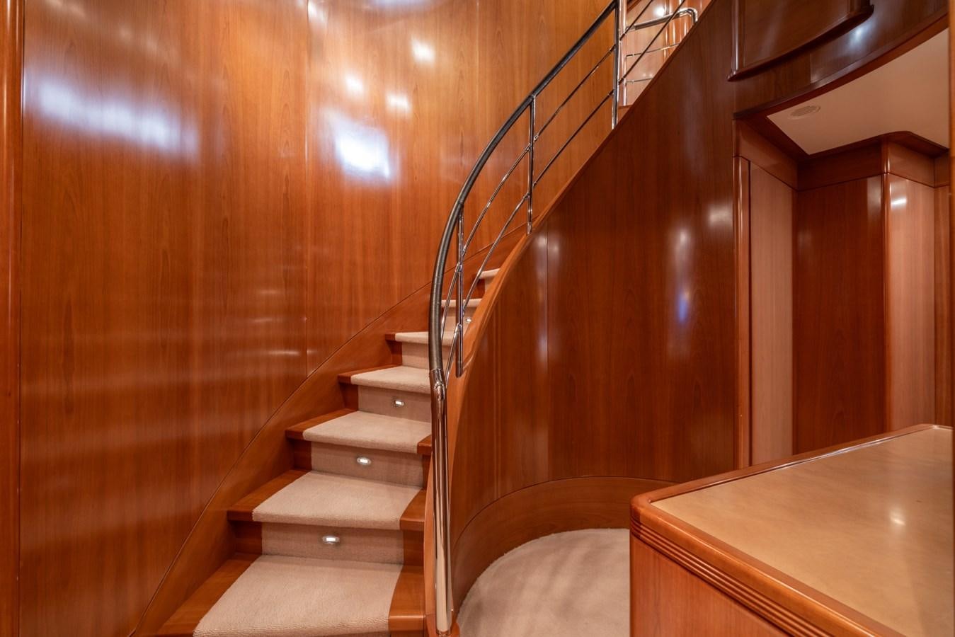 a wooden staircase with a railing aboard ALEGRIA Yacht for Sale