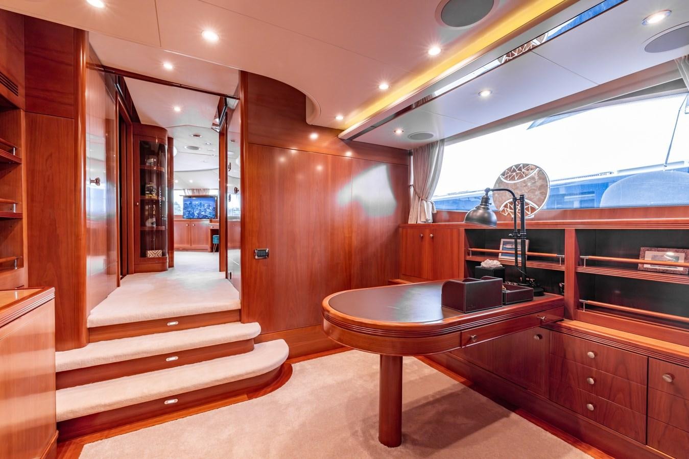 a room with a table and a fan aboard ALEGRIA Yacht for Sale