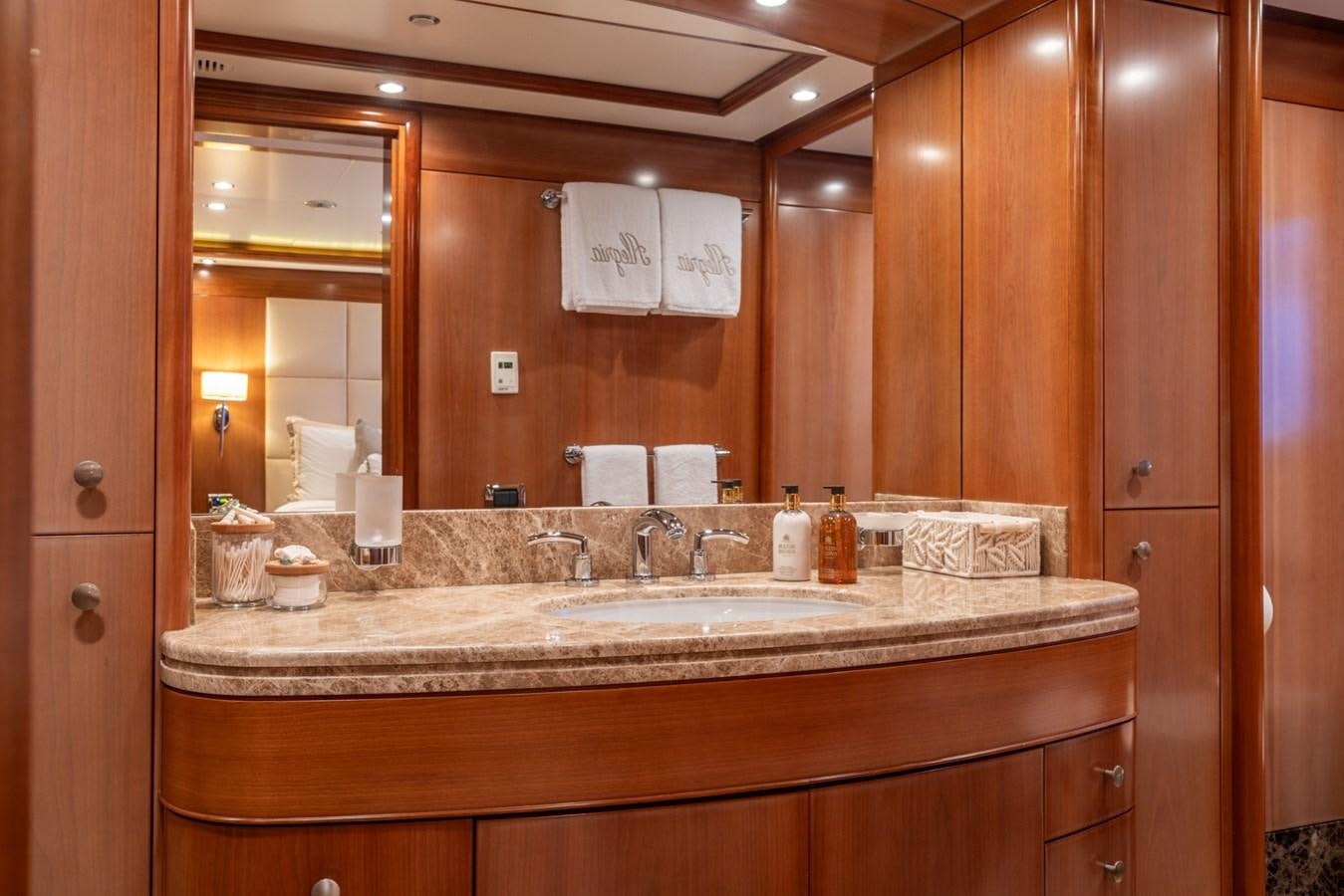 a bathroom with a large mirror aboard ALEGRIA Yacht for Sale