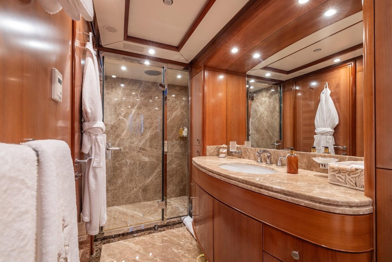 a bathroom with a large mirror aboard ALEGRIA Yacht for Sale