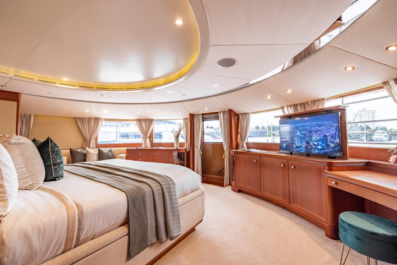 a room with a bed and a television aboard ALEGRIA Yacht for Sale