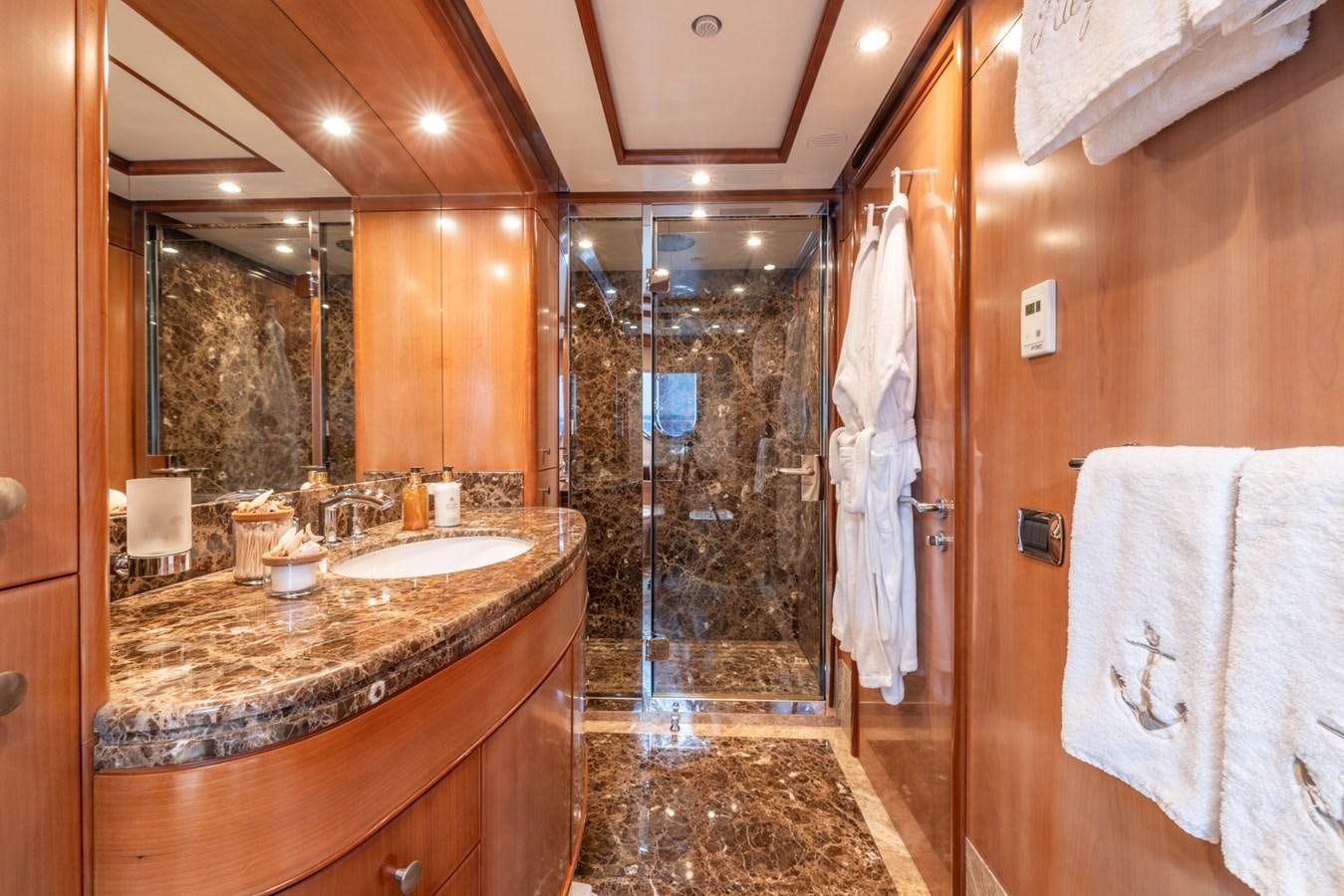 a bathroom with a glass shower aboard ALEGRIA Yacht for Sale