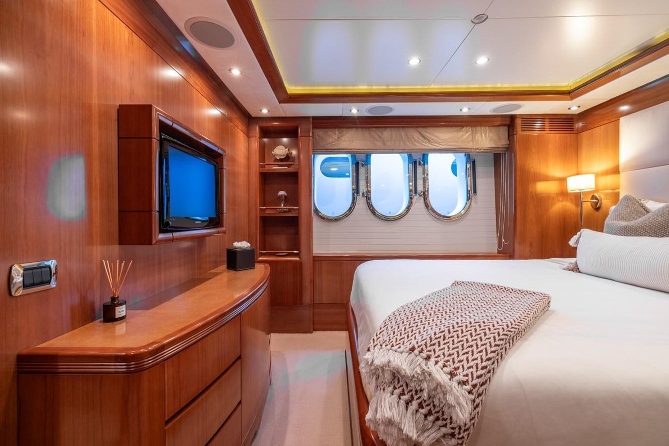 a room with a bed and a tv aboard ALEGRIA Yacht for Sale
