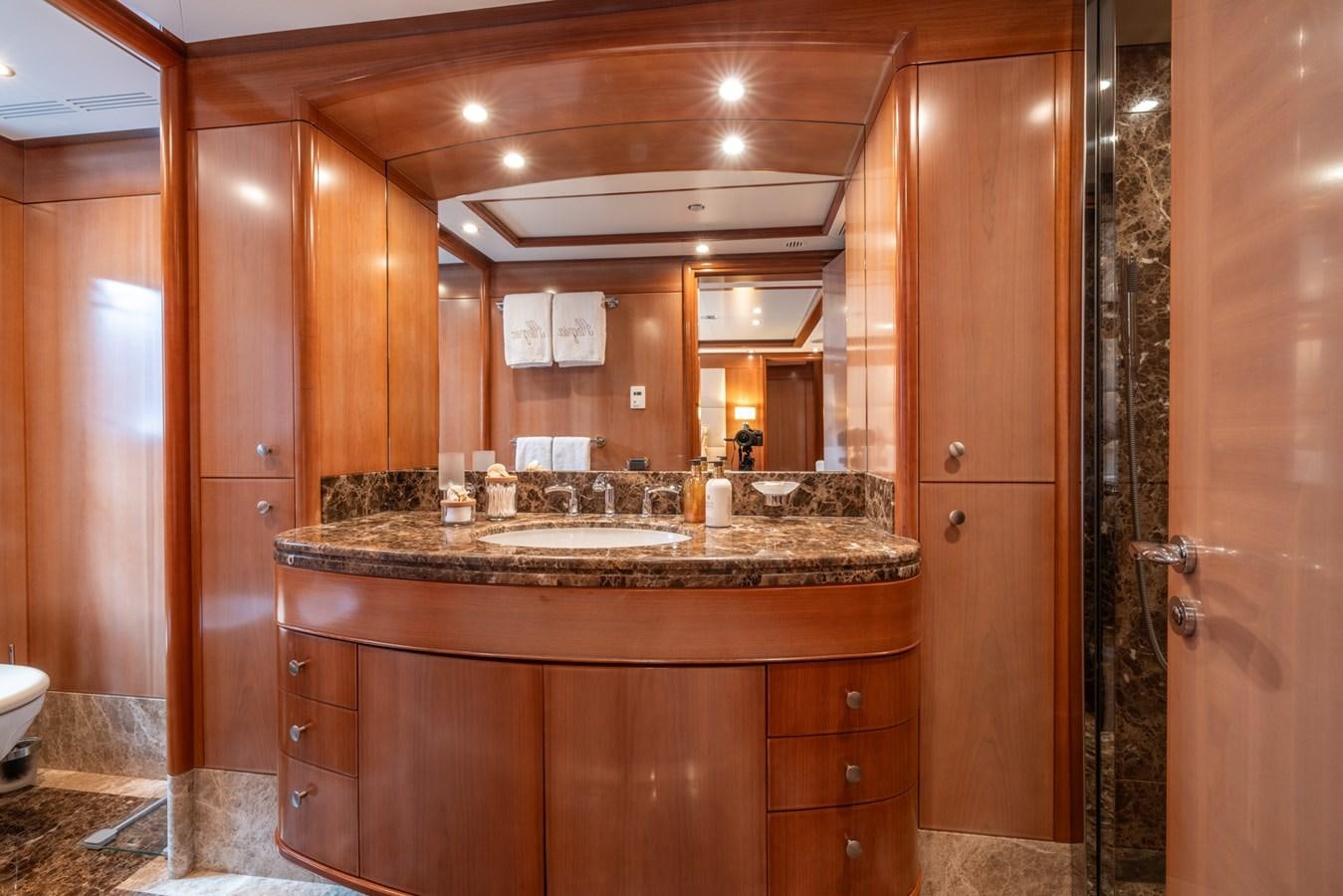 a bathroom with a large mirror aboard ALEGRIA Yacht for Sale