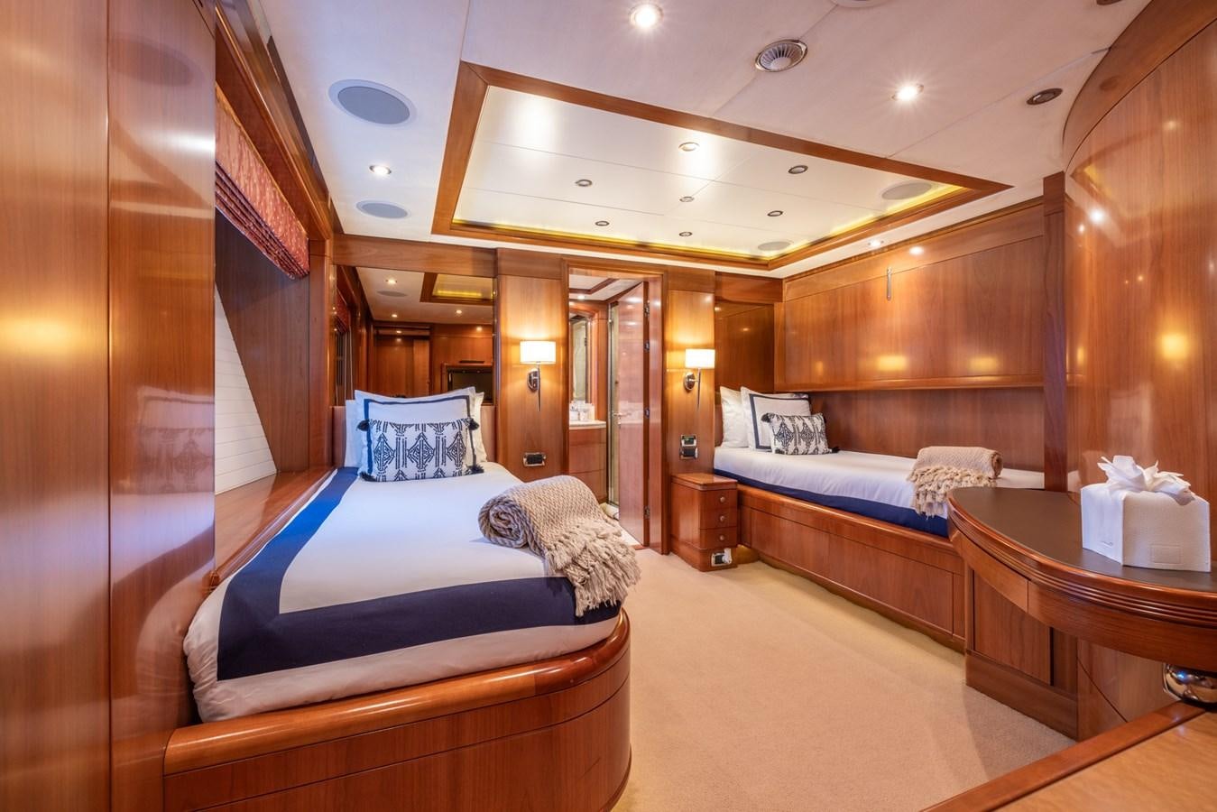 a room with a bed and a table aboard ALEGRIA Yacht for Sale