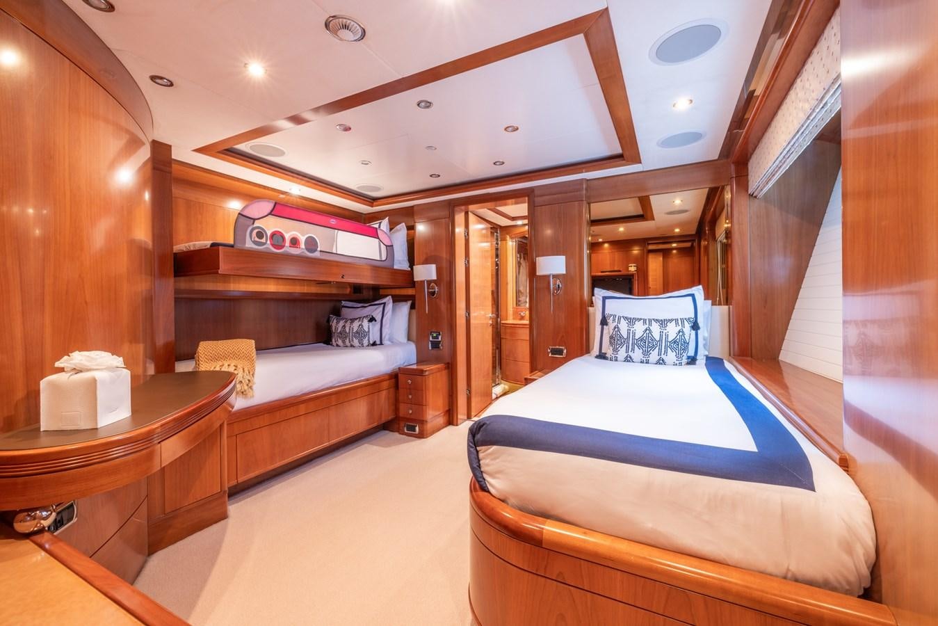 a room with a bed and a desk aboard ALEGRIA Yacht for Sale