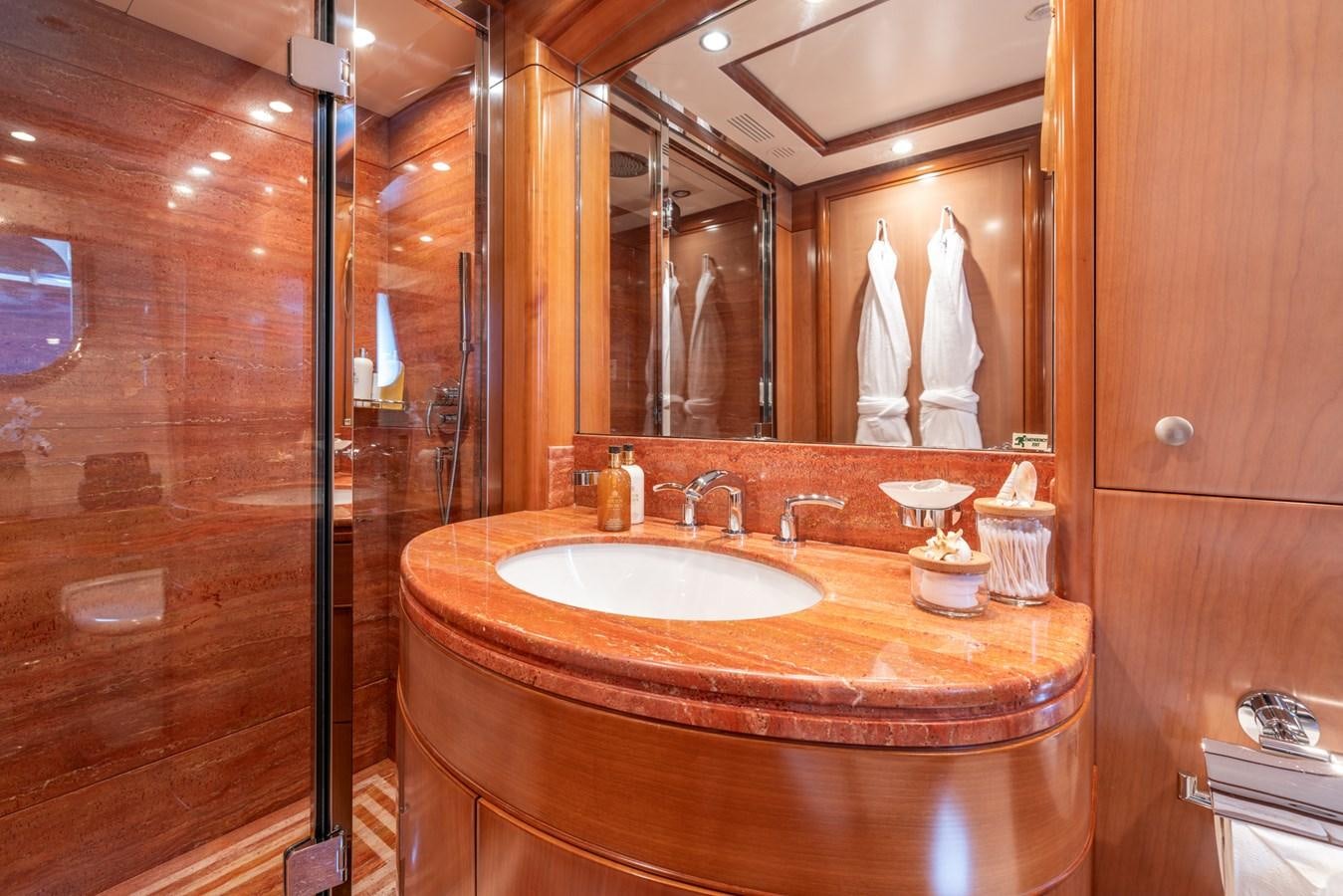 a bathroom with a large mirror aboard ALEGRIA Yacht for Sale