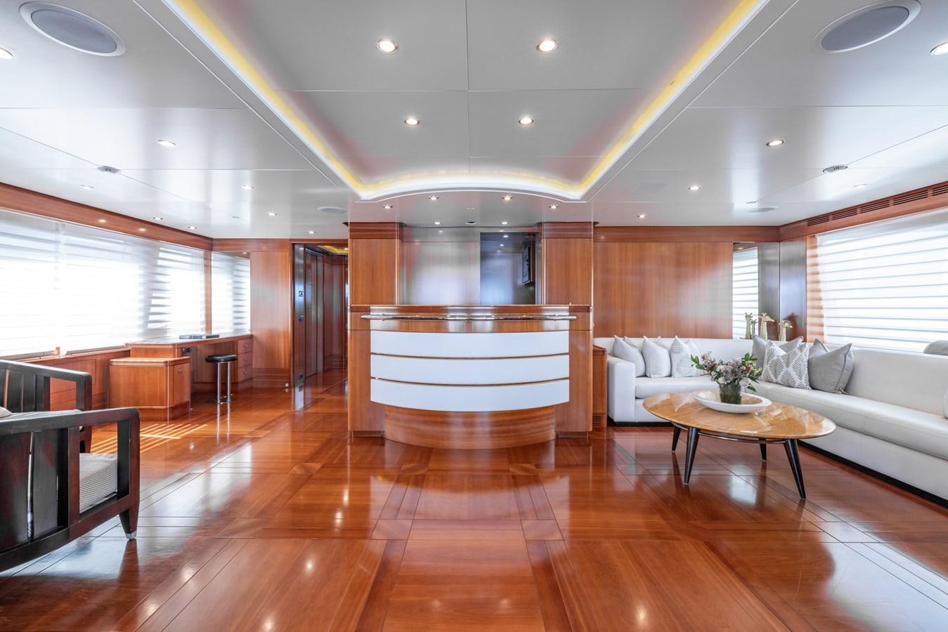 a large living room with a wood floor aboard ALEGRIA Yacht for Sale