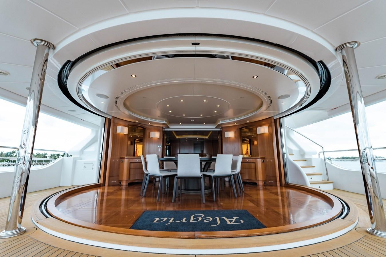 a large room with a table and chairs aboard ALEGRIA Yacht for Sale