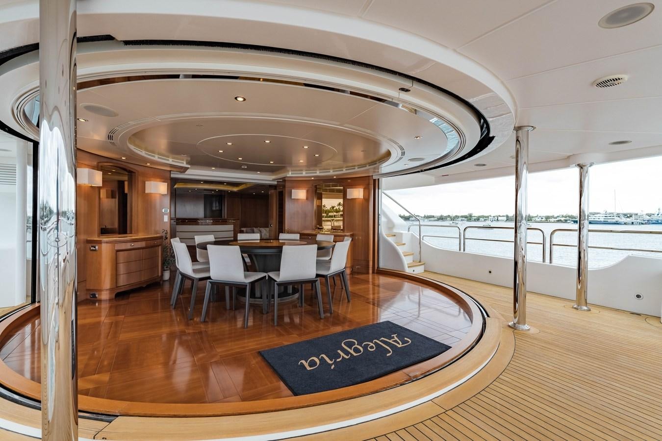 a large room with tables and chairs aboard ALEGRIA Yacht for Sale