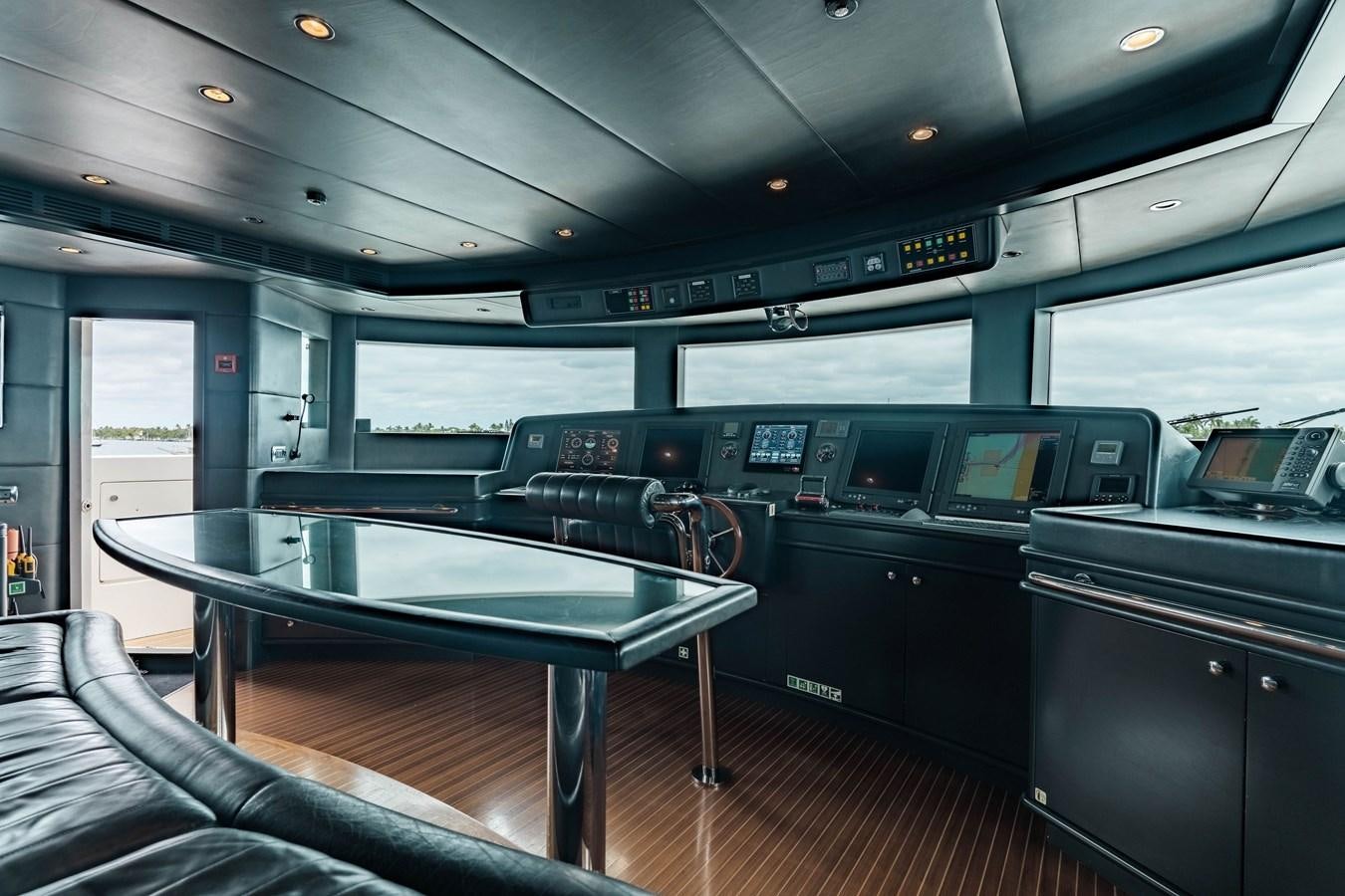 a table and chairs in a bus aboard ALEGRIA Yacht for Sale
