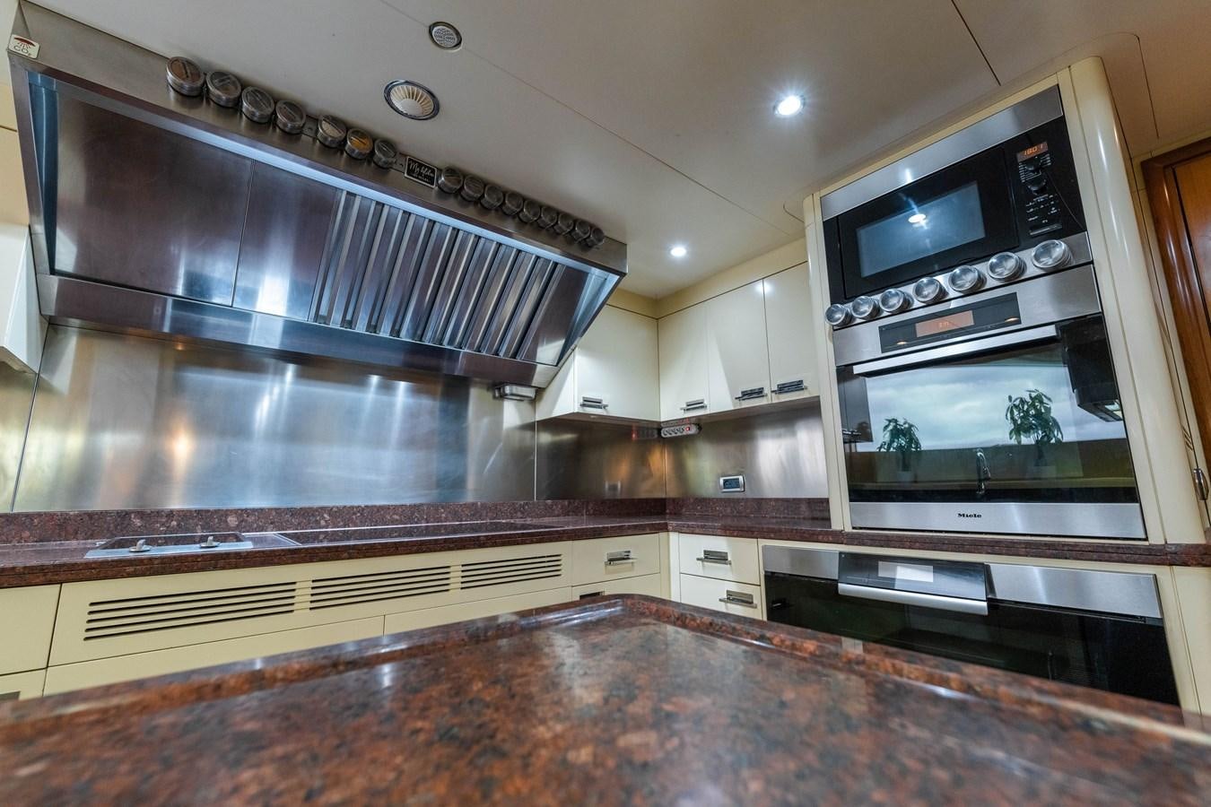 a kitchen with a large stainless steel oven aboard ALEGRIA Yacht for Sale