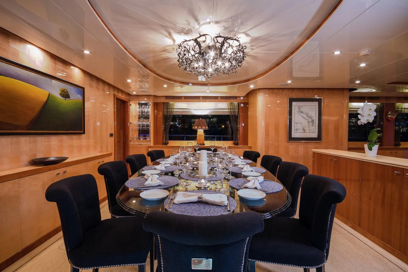 a dining room with a table and chairs aboard KOMOKWA Yacht for Charter
