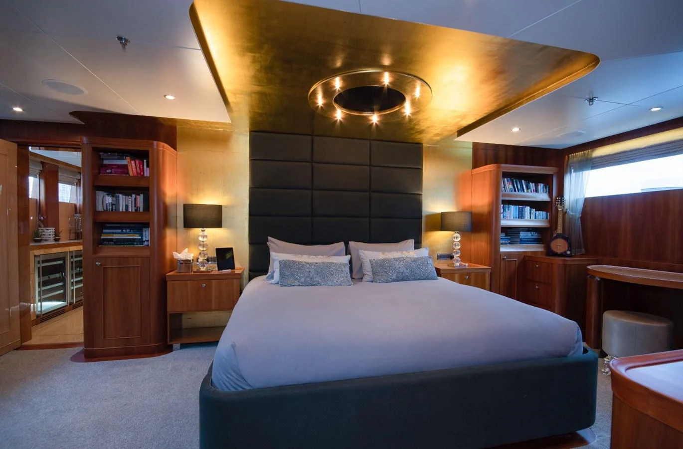 a bedroom with a large bed aboard KOMOKWA Yacht for Charter