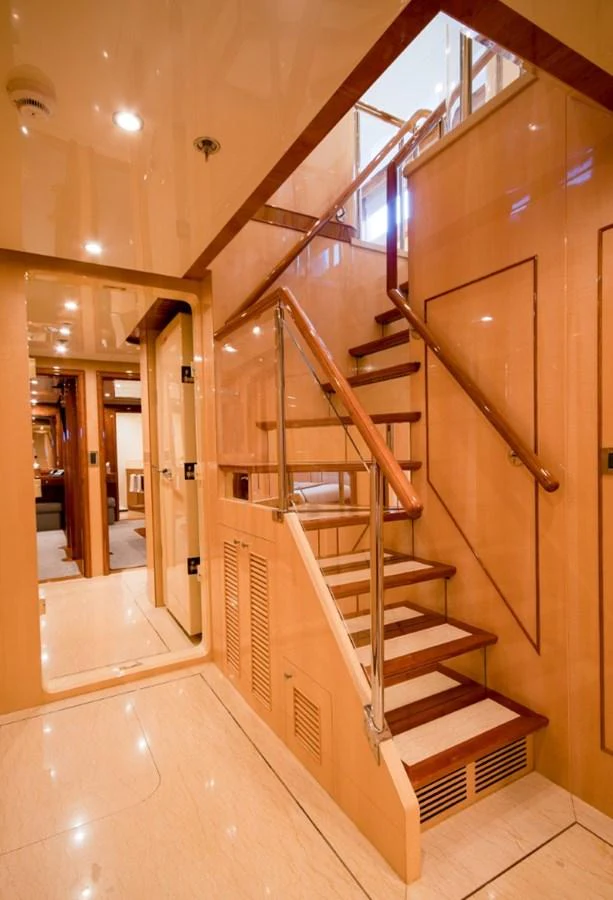a staircase in a building aboard KOMOKWA Yacht for Charter
