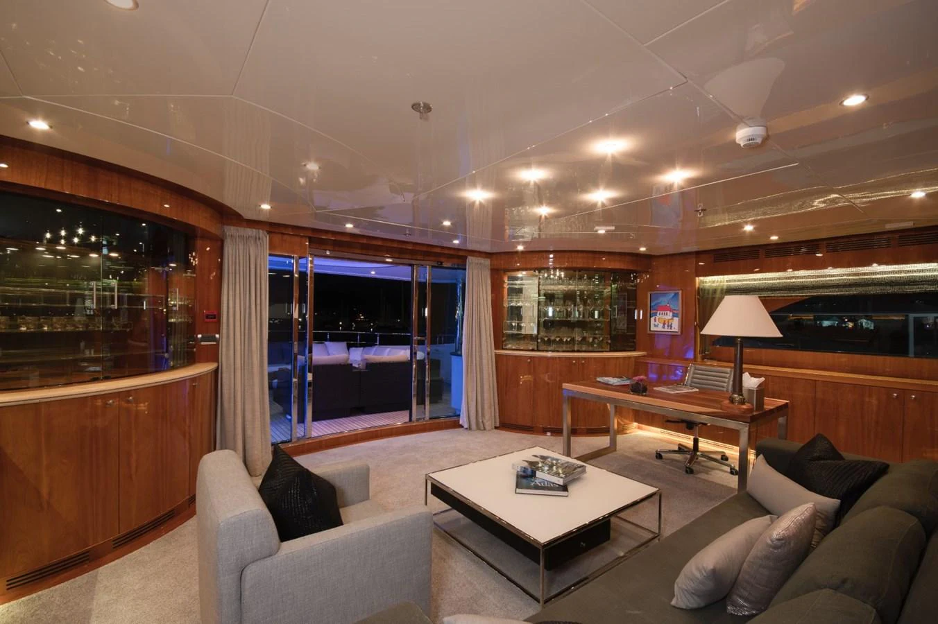 a living room with a table and chairs aboard KOMOKWA Yacht for Charter