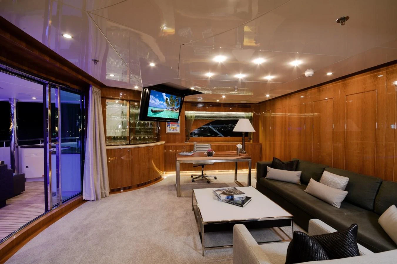 a living room with a large mirror aboard KOMOKWA Yacht for Charter