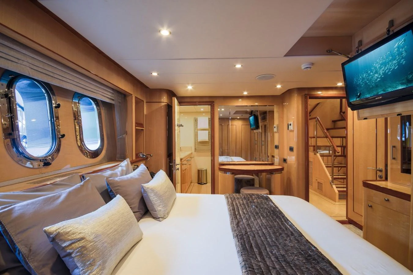 a bed in a room aboard KOMOKWA Yacht for Charter