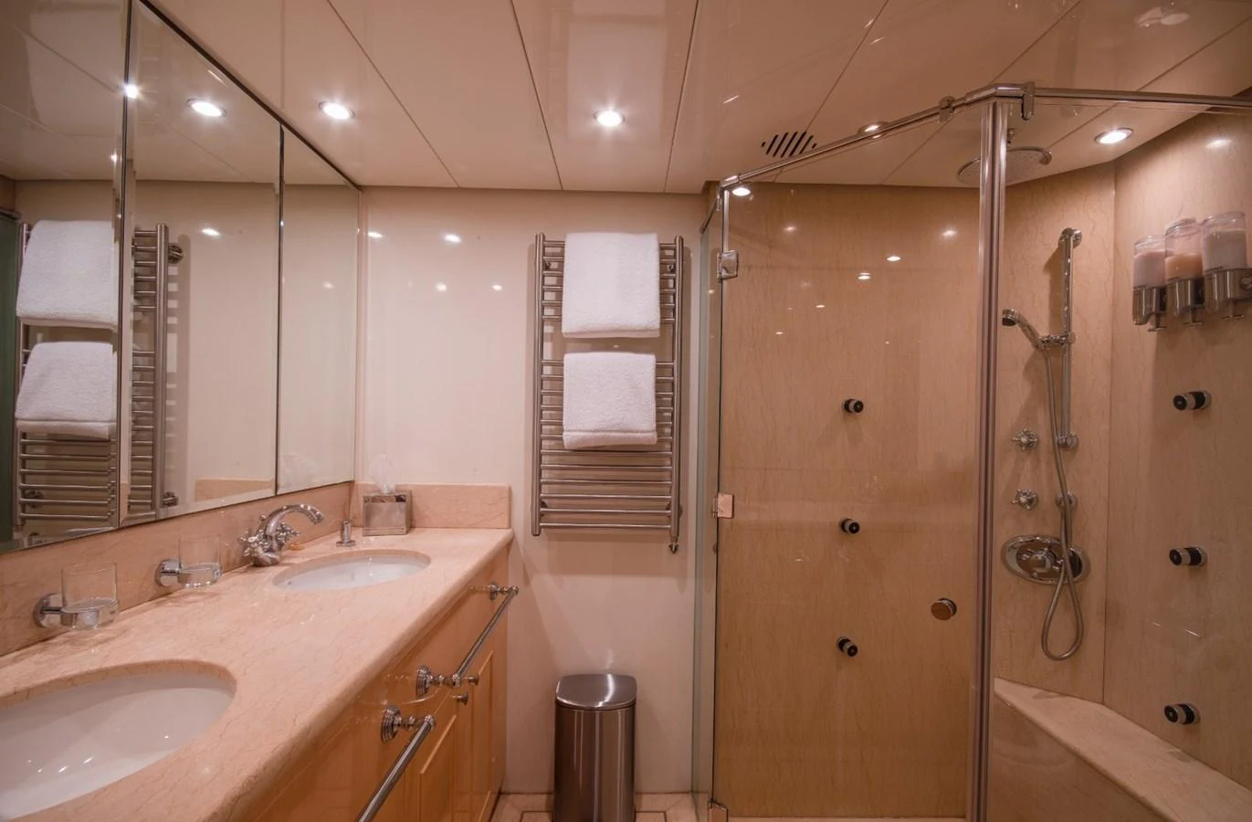 a bathroom with a shower and sink aboard KOMOKWA Yacht for Charter