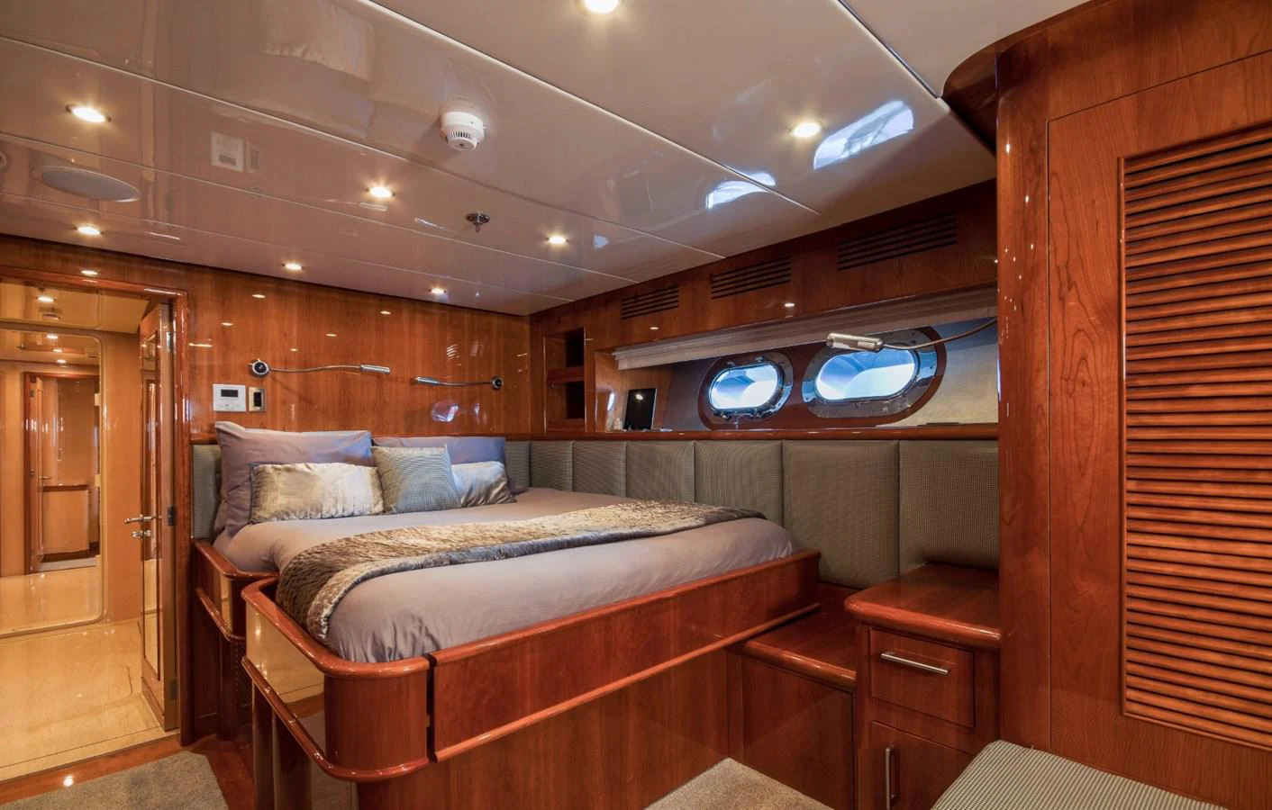 a bedroom with a bed and a television aboard KOMOKWA Yacht for Charter