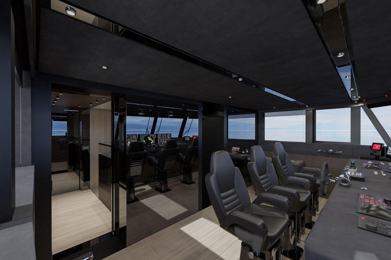 inside of a vehicle with a large screen and chairs and tables aboard AES NB 066 Yacht for Sale