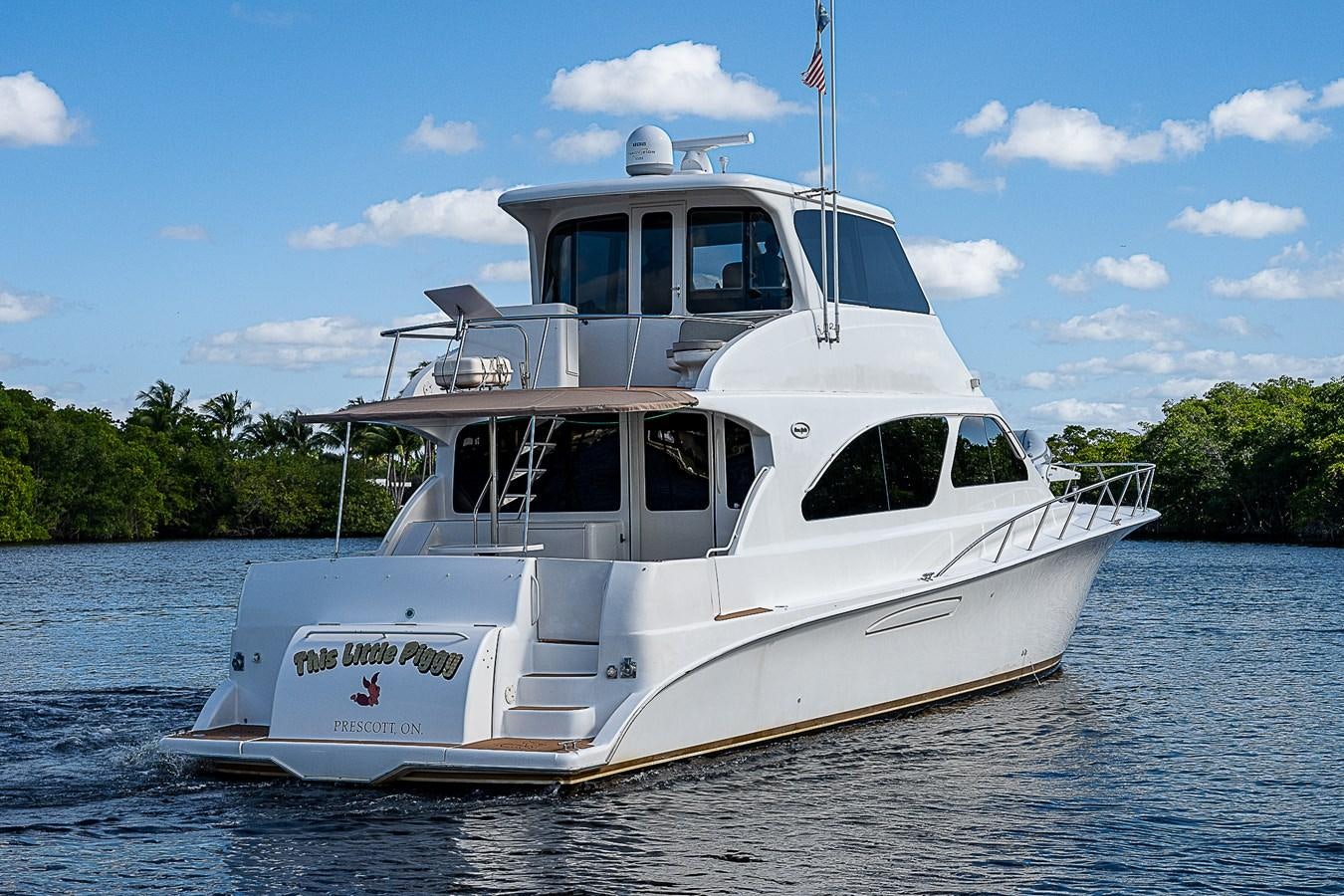 a white boat on the water aboard THIS LITTLE PIGGY Yacht for Sale