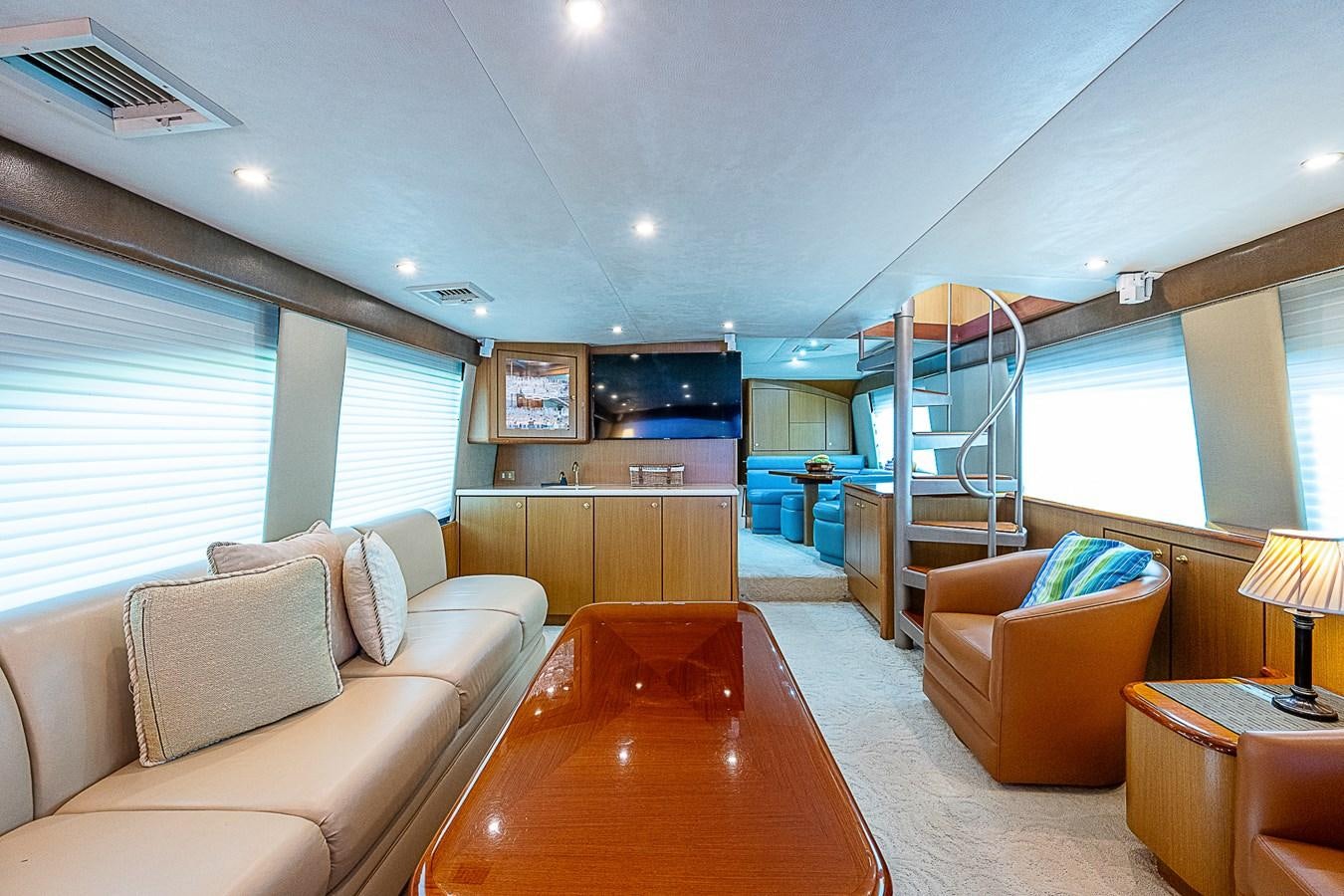 a living room with a large window aboard THIS LITTLE PIGGY Yacht for Sale