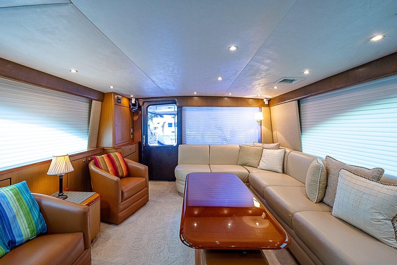 a living room with a couch and a table aboard THIS LITTLE PIGGY Yacht for Sale