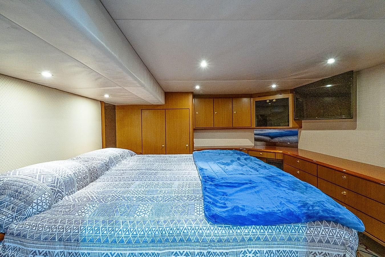 a bedroom with two beds aboard THIS LITTLE PIGGY Yacht for Sale