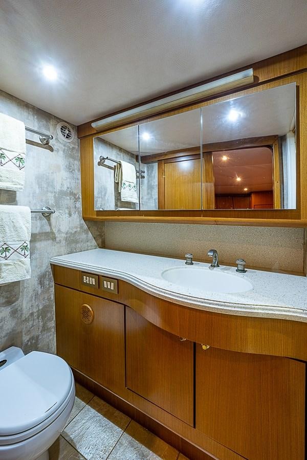 a bathroom with a sink and a toilet aboard THIS LITTLE PIGGY Yacht for Sale