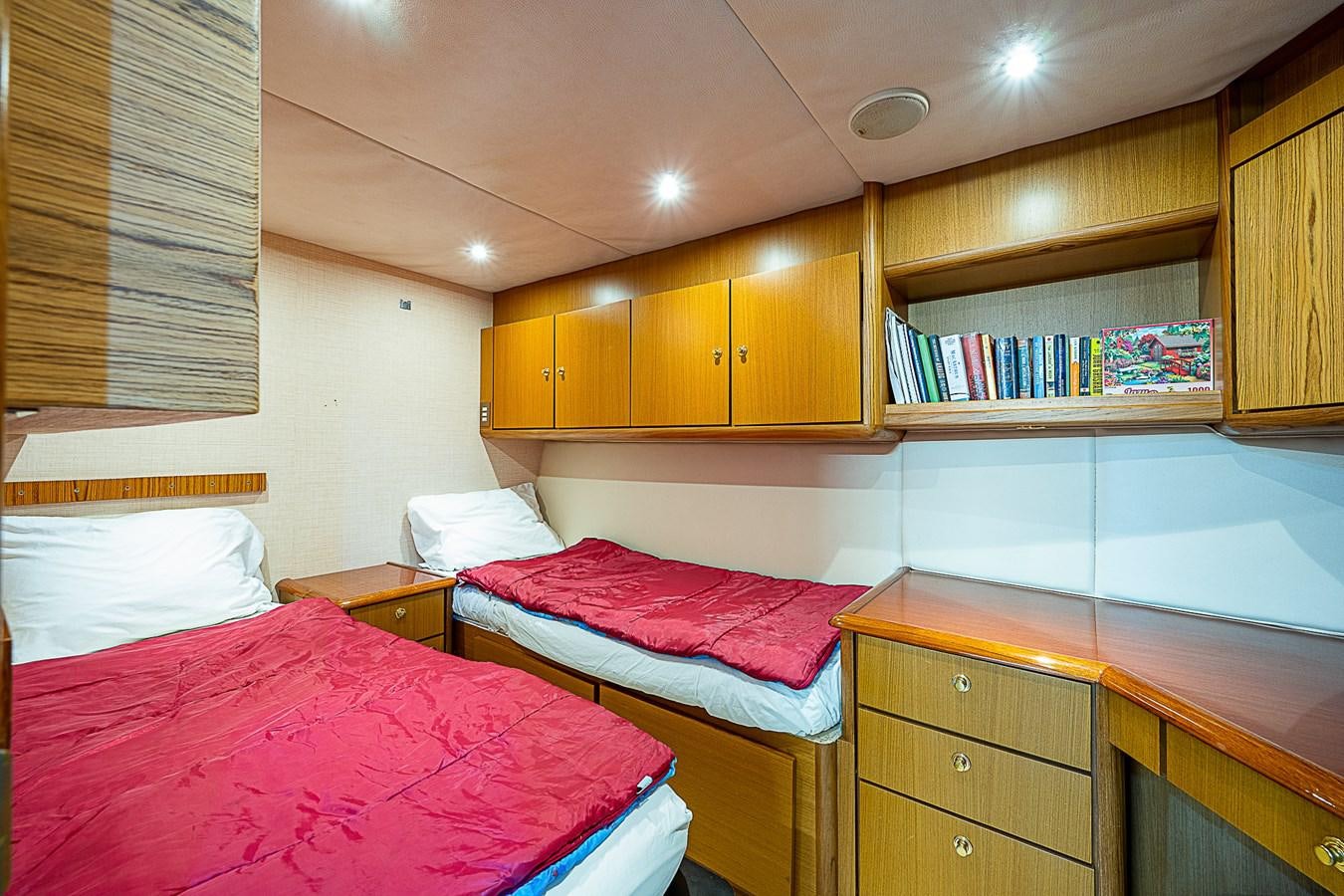 a couple of beds in a room aboard THIS LITTLE PIGGY Yacht for Sale
