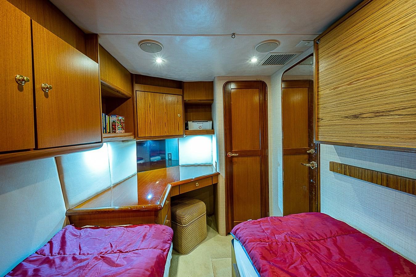a cabin with a bed and a microwave aboard THIS LITTLE PIGGY Yacht for Sale