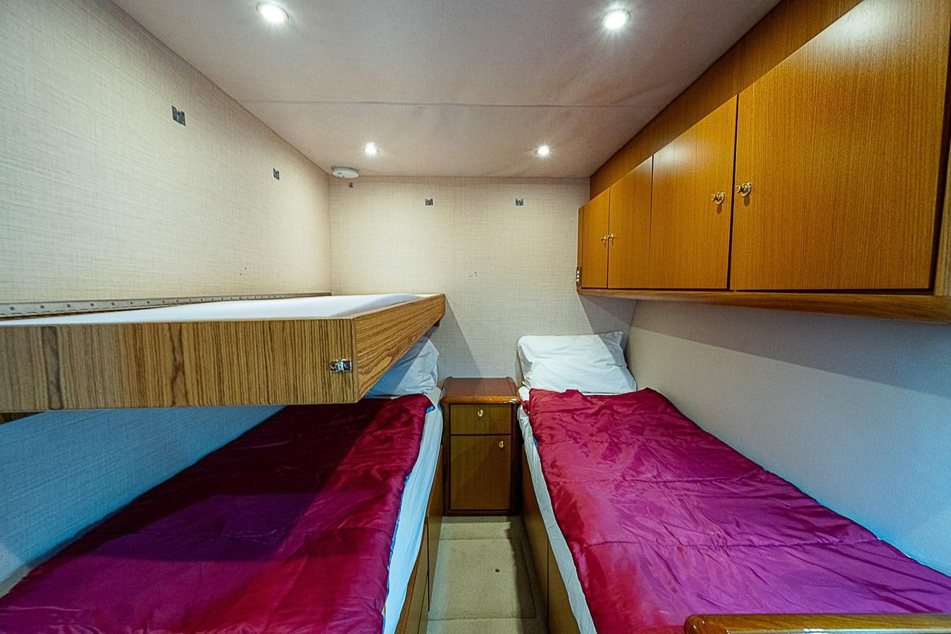 a couple of beds in a room aboard THIS LITTLE PIGGY Yacht for Sale