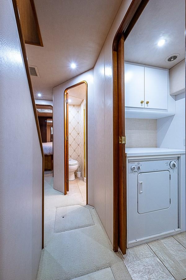 a bathroom with a white toilet aboard THIS LITTLE PIGGY Yacht for Sale
