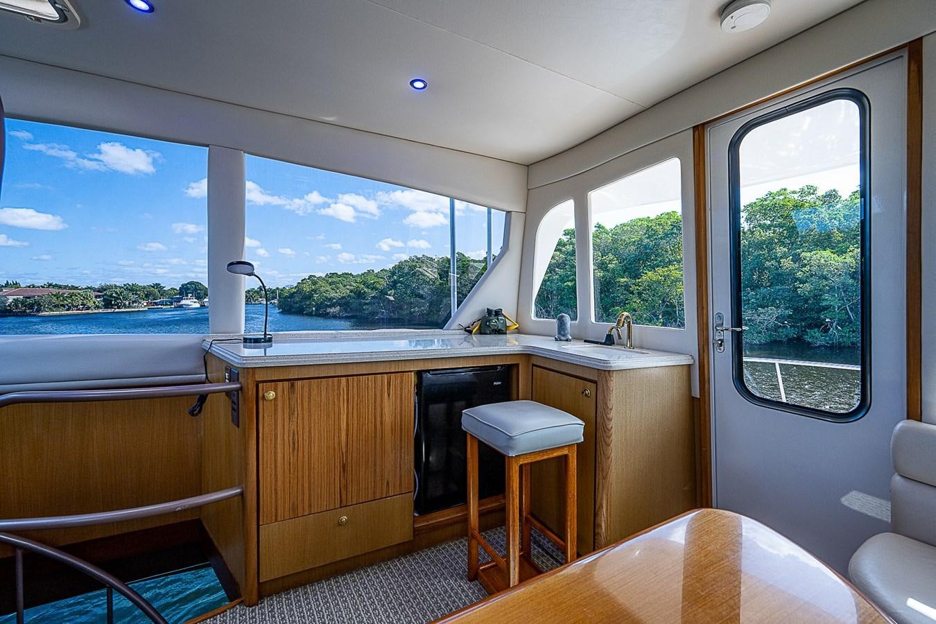 a room with a large window aboard THIS LITTLE PIGGY Yacht for Sale