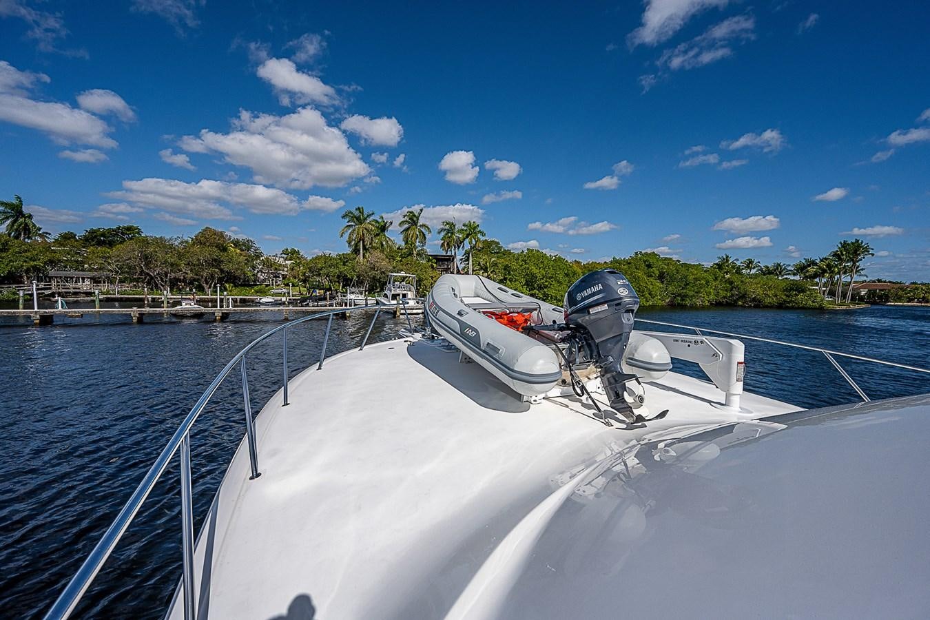 a boat with a helmet on it aboard THIS LITTLE PIGGY Yacht for Sale