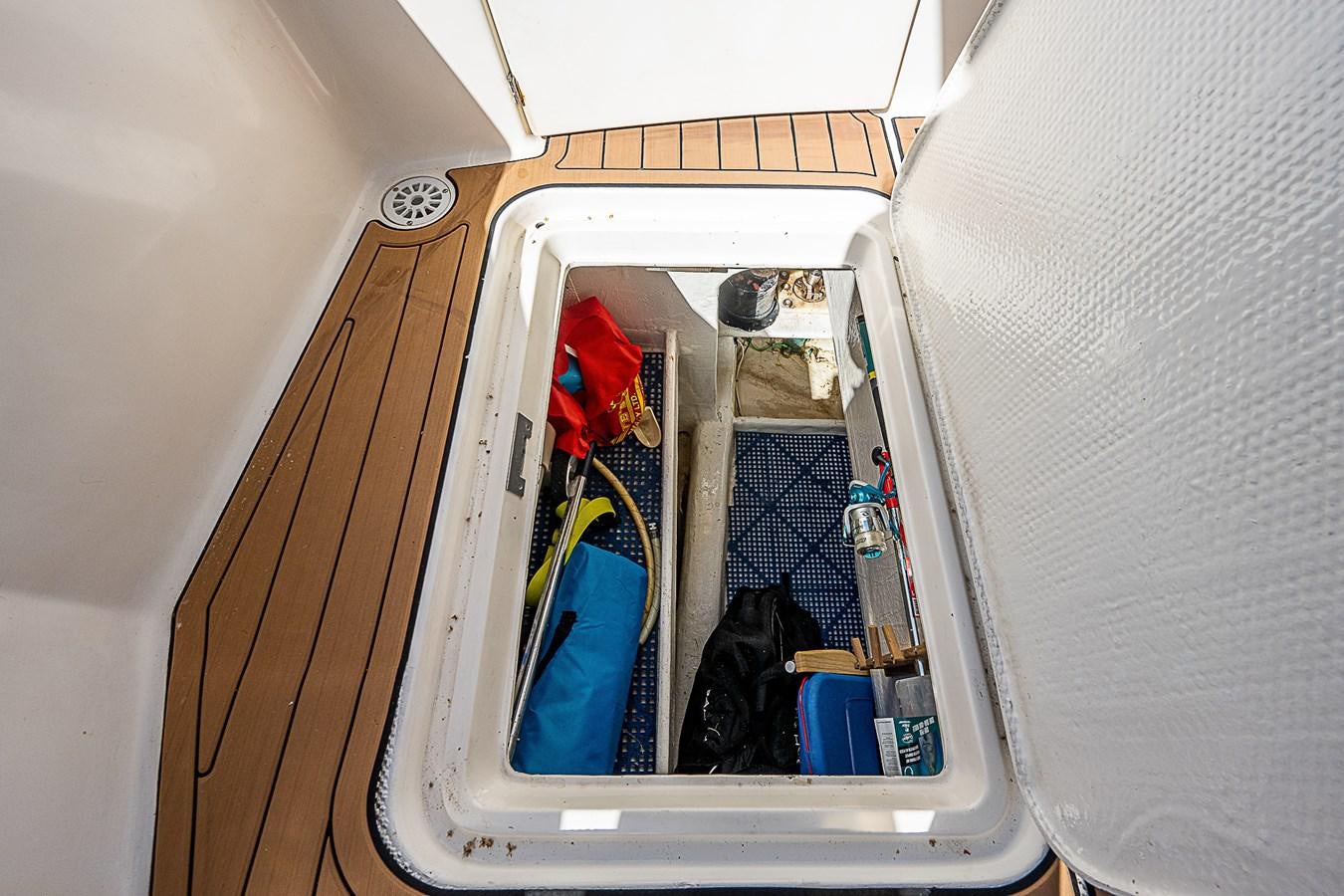 a car with a door open aboard THIS LITTLE PIGGY Yacht for Sale