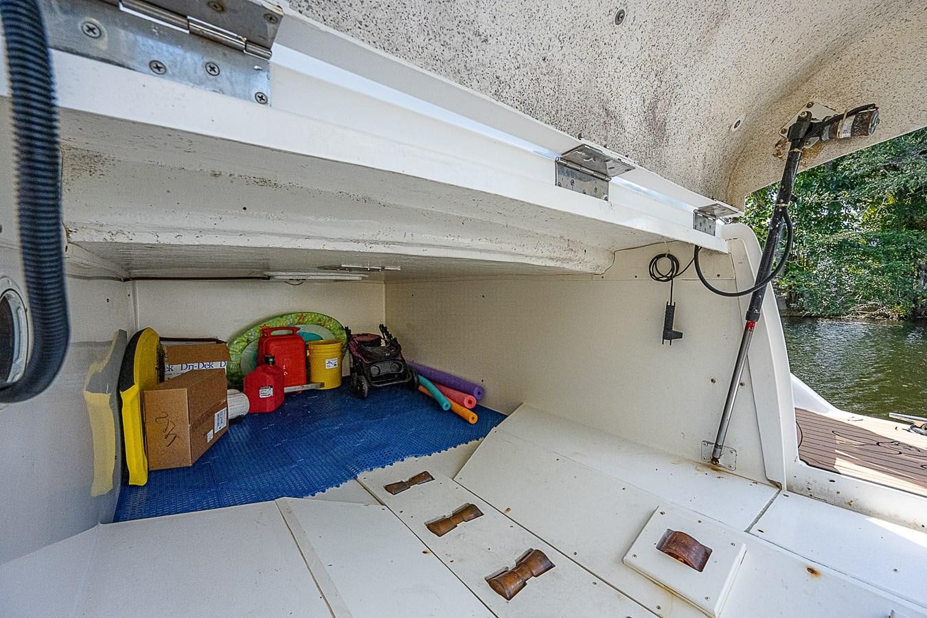 a boat with a bucket and a bucket on the deck aboard THIS LITTLE PIGGY Yacht for Sale