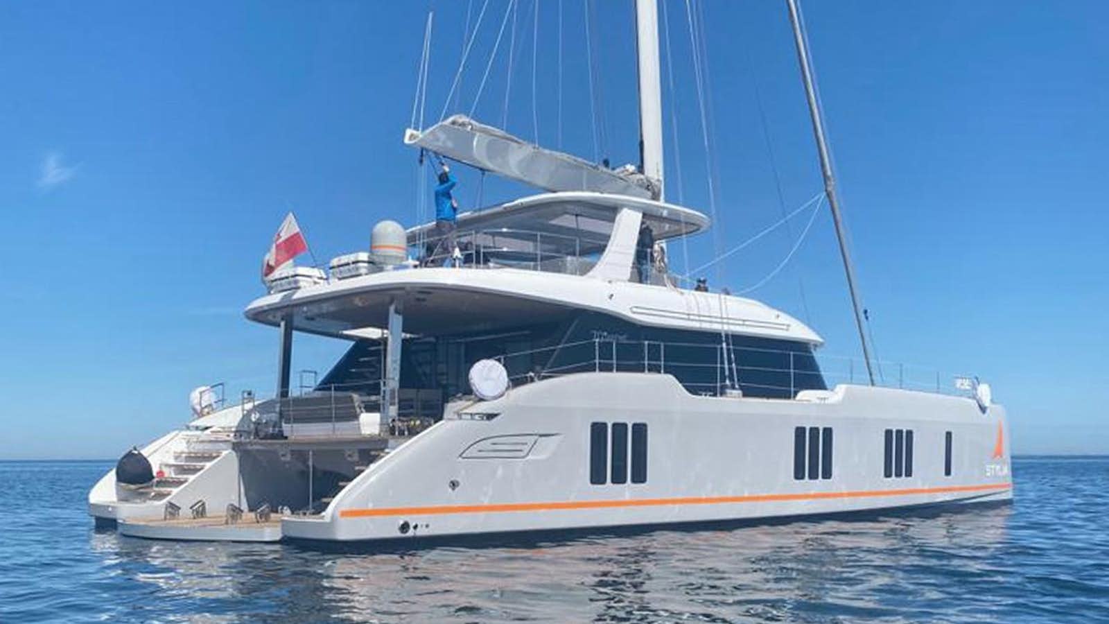 a large white boat in the water aboard STYLIA Yacht for Sale