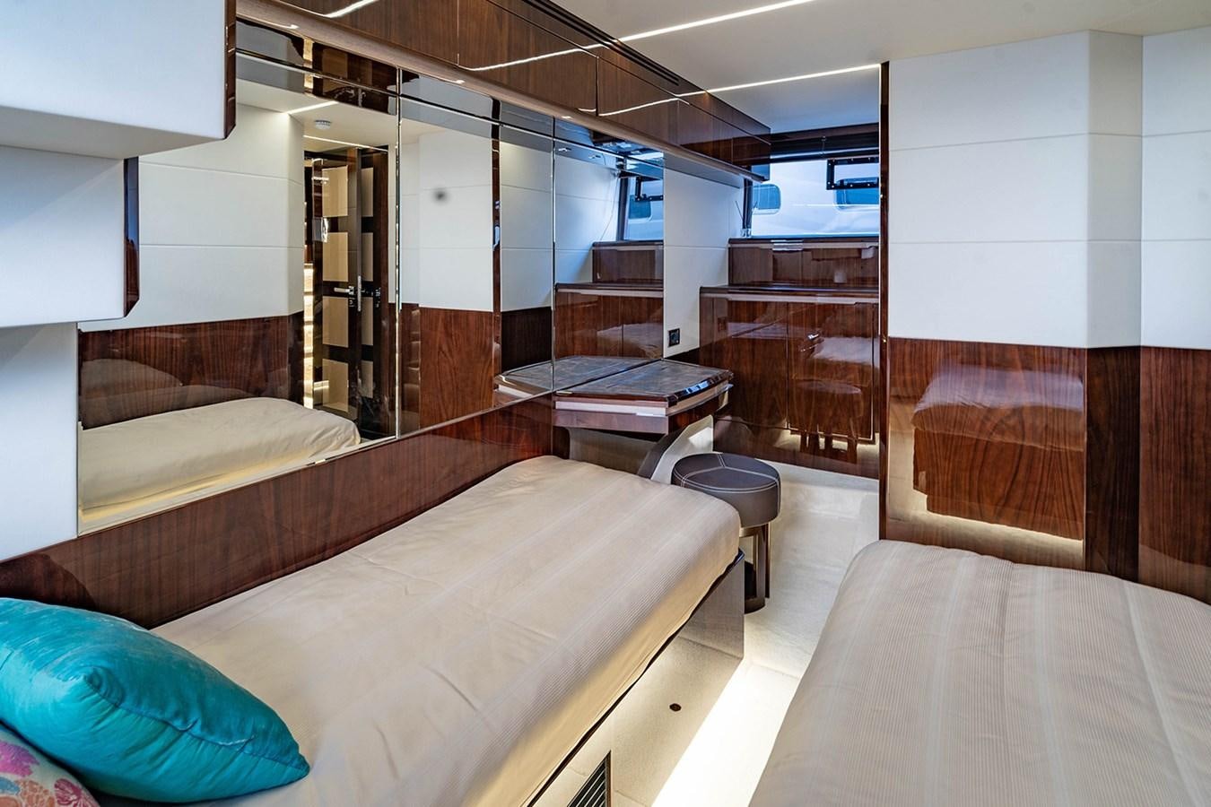 a room with a bed and a table aboard AQUAMARINA Yacht for Sale