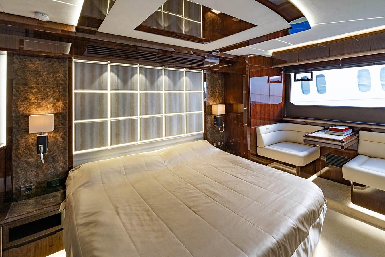 a room with a bed and a tv aboard AQUAMARINA Yacht for Sale