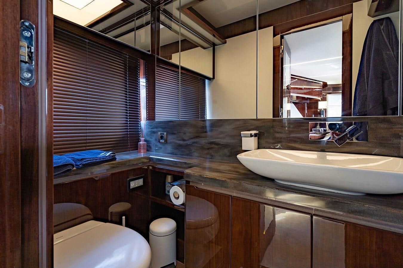 a bathroom with a sink and toilet aboard AQUAMARINA Yacht for Sale