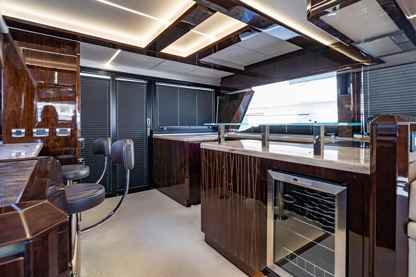 a room with a large window and a large wood table aboard AQUAMARINA Yacht for Sale
