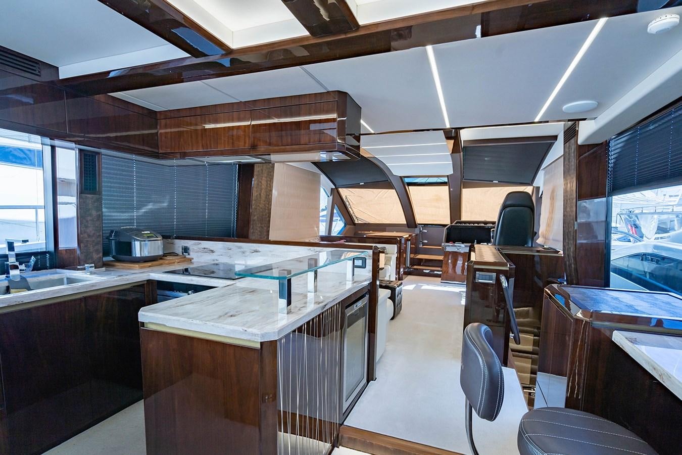 a kitchen with a large window aboard AQUAMARINA Yacht for Sale