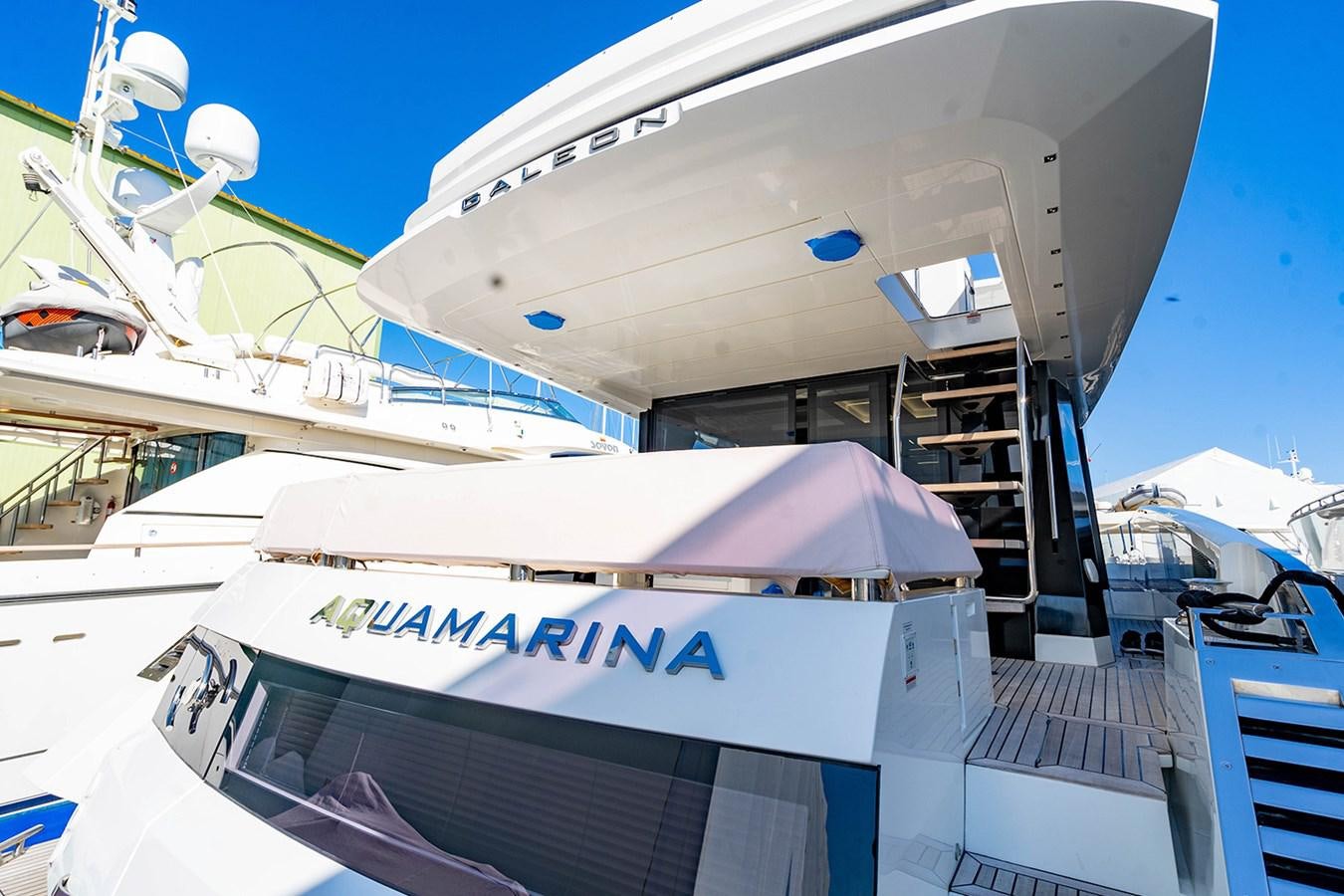 a boat docked at a pier aboard AQUAMARINA Yacht for Sale