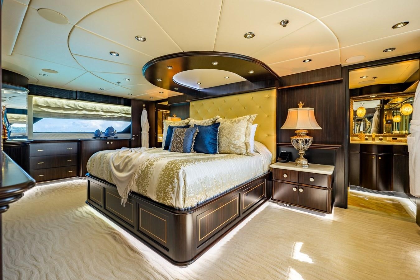a large bedroom with a large bed aboard GRADE I Yacht for Charter